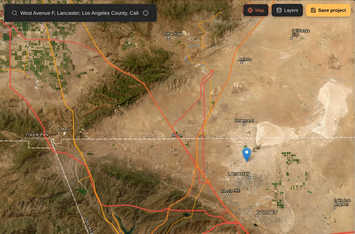 Satellite view with transmission lines colour-coded by voltage