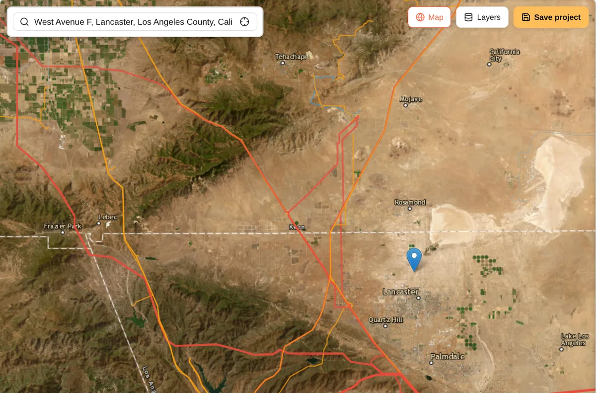 Satellite view with transmission lines colour-coded by voltage